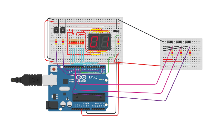 Circuit design display 7 segmentos contador | Tinkercad